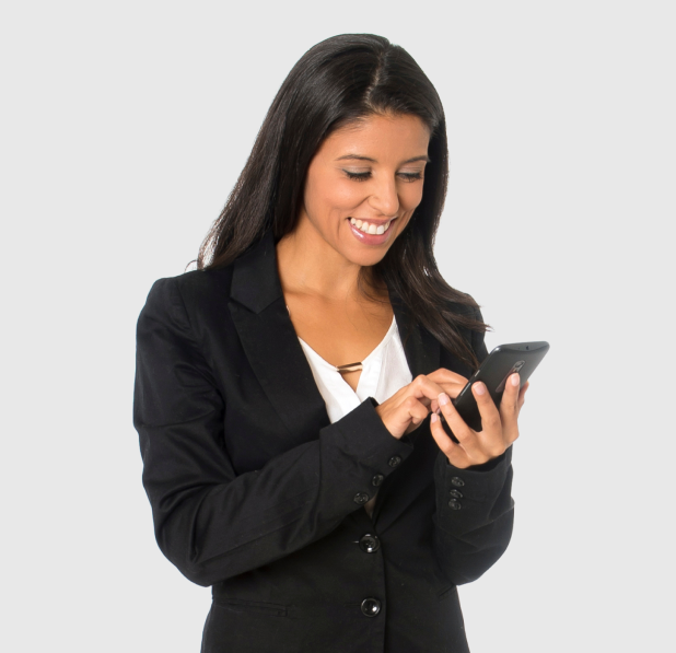 Smiling woman in a suit using the call transcription feature on a smartphone